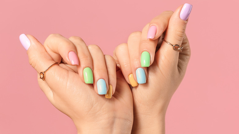 Hands with colorful pastel nails