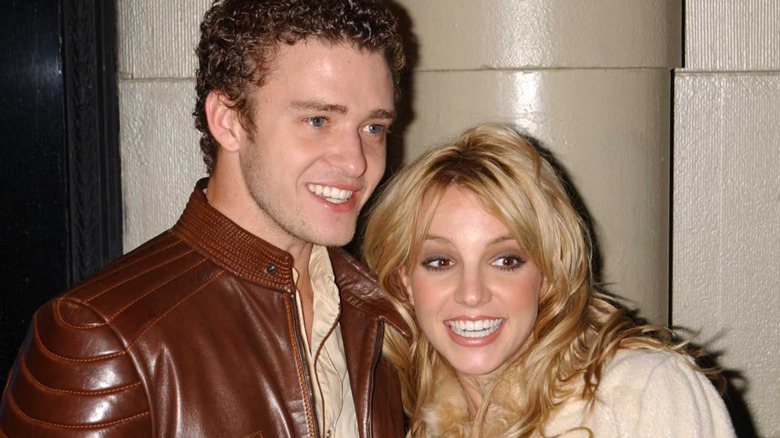 Britney Spears smiling widely with Justin Timberlake