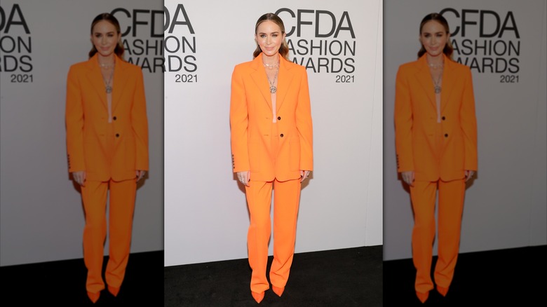 Emily Blunt in a bright orange suit