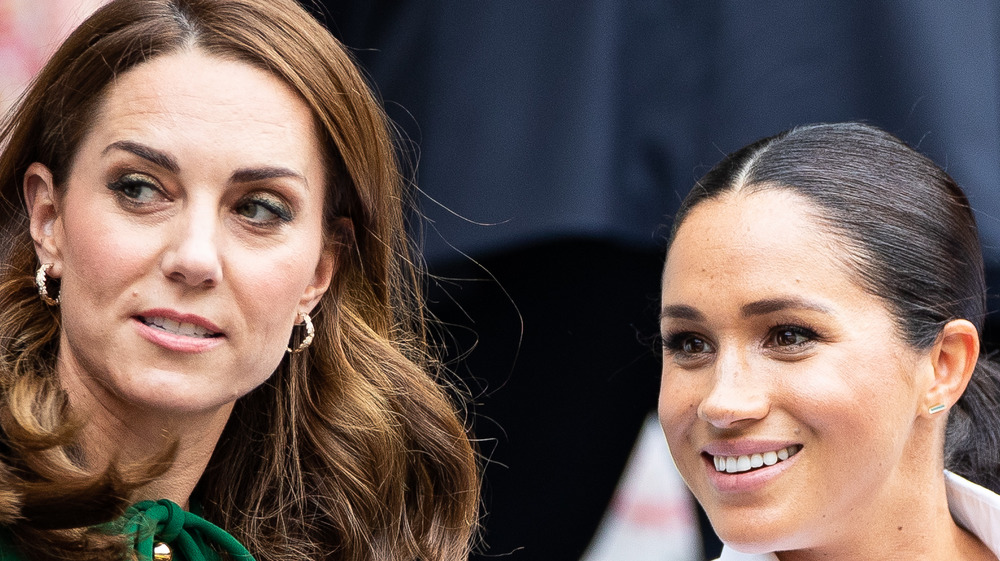 Kate Middleton and Meghan Markle talking