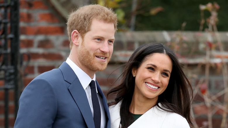 Prince Harry and Meghan smiling 