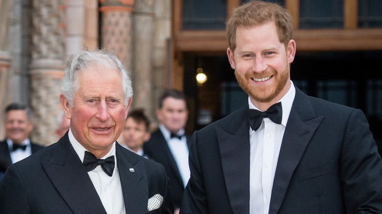 Prince Harry and King Charles smiling