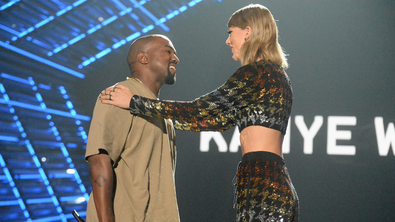 Ye West and Taylor Swift talking to each other at the MTV Video Music Awards at Microsoft Theater in Los Angeles, California (2015)