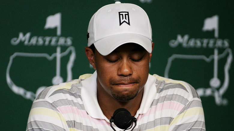 Tiger Woods casting his eyes downward during a press conference