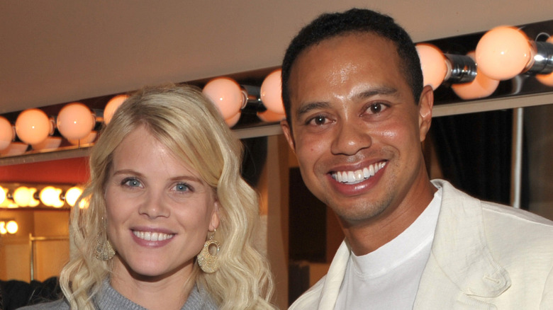Smiling Elin Nordegren with then-husband Tiger Woods