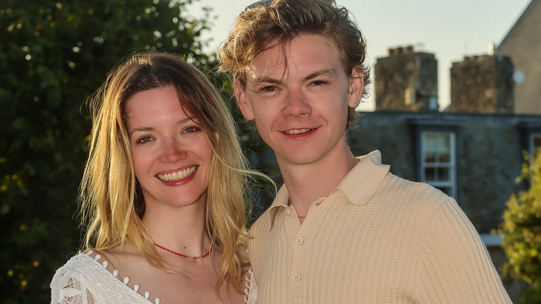 Thomas Brodie-Sangster and Talulah Riley smiling 