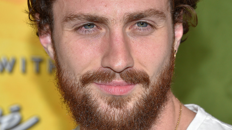 Aaron Taylor-Johnson posing at event