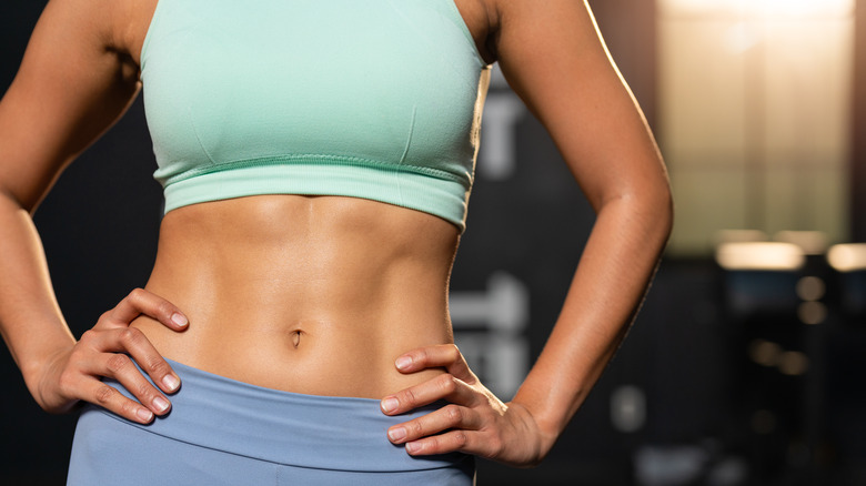 Zoomed-in shot of woman's toned abs