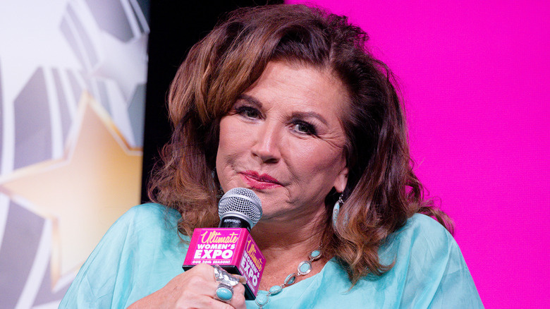 abby lee miller holding microphone