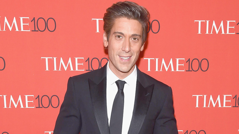 David Muir smiling for the camera at the TIME100 event