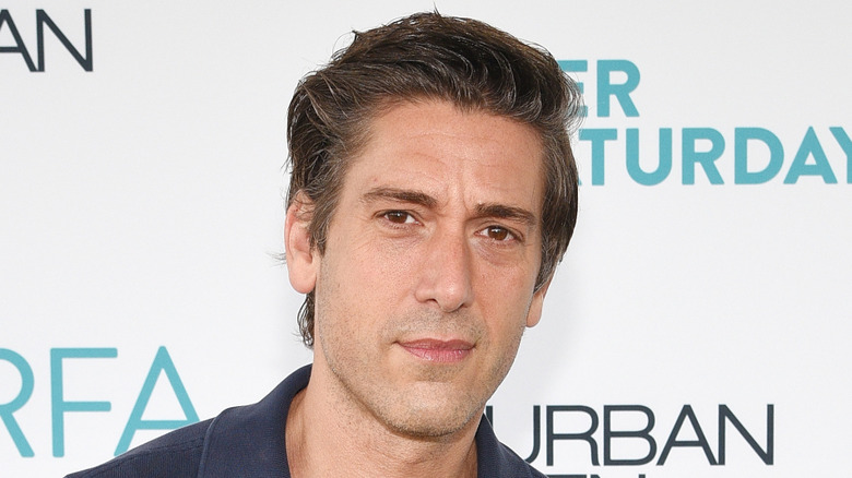 David Muir wearing a blue polo shirt