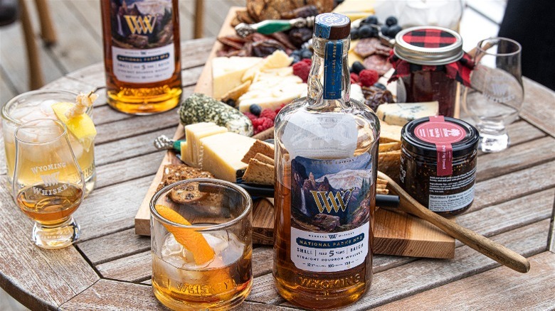 Whiskey bottle and charcuterie board