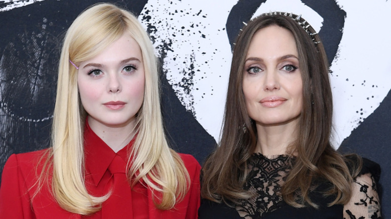 Angelina Jolie and Elle Woods posing at an event