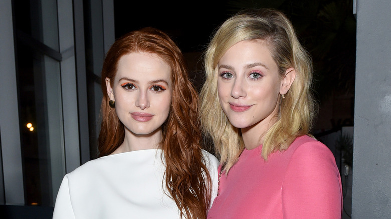 Lili Reinhart and Madelaine Petsch posing at an event