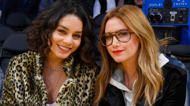 Ashley Tisdale and Vanessa Hudgens at a basketball game