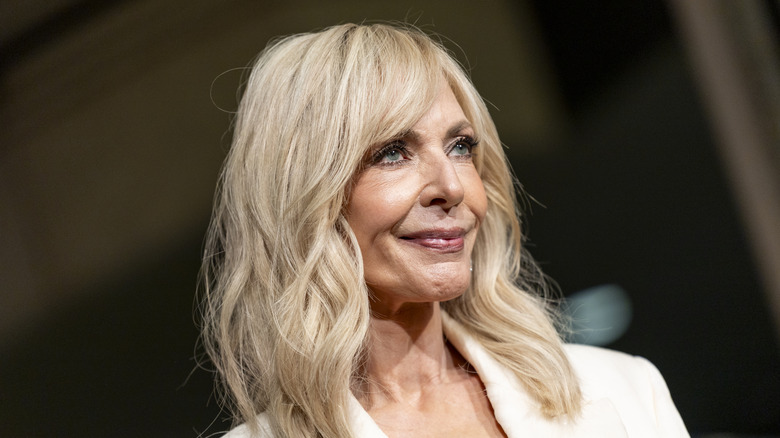 Allison Janney in soft blonde waves and white outfit