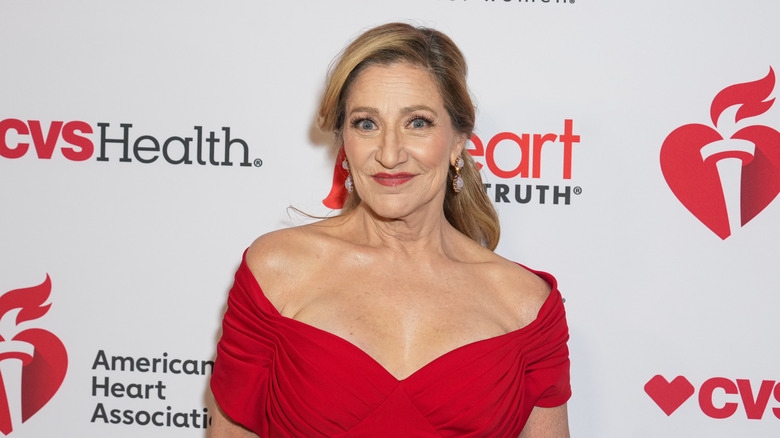 Edie Falco wearing an off-shoulder red dress