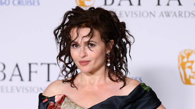 Helena Bonham Carter in an off-shoulder black dress and messy curls