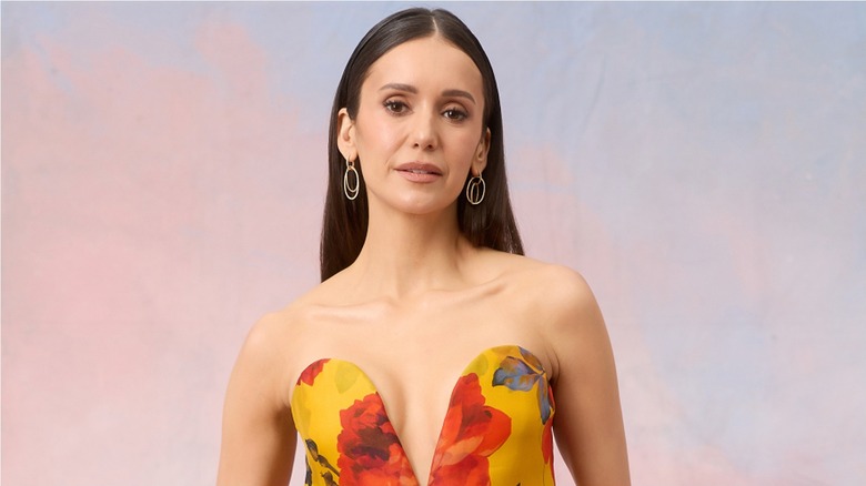 Nina Dobrev wearing a strapless flowery dress