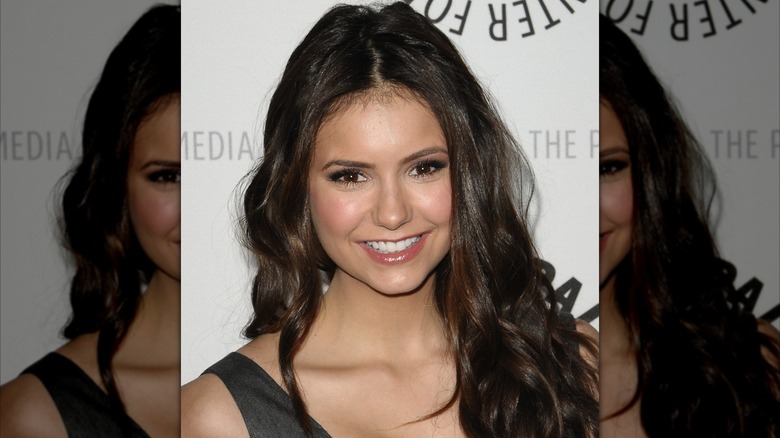 Nina Dobrev smiling at a "Vampire Diaries" event