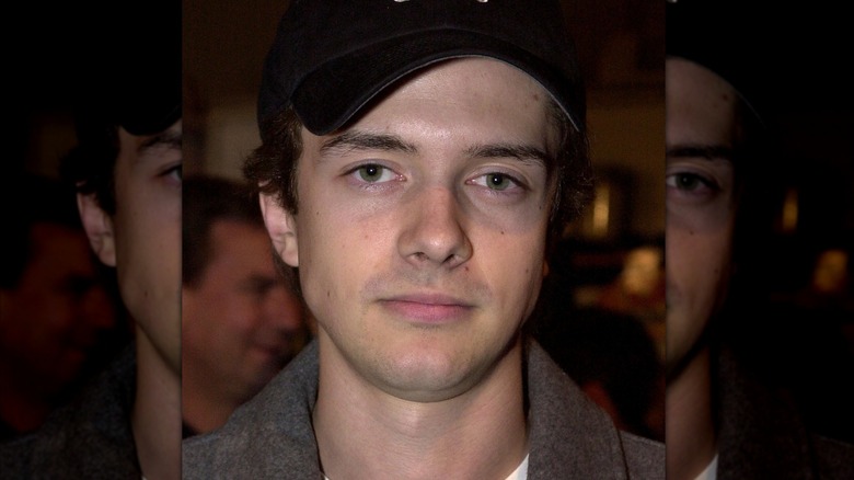 Topher Grace wearing a cap in 2000