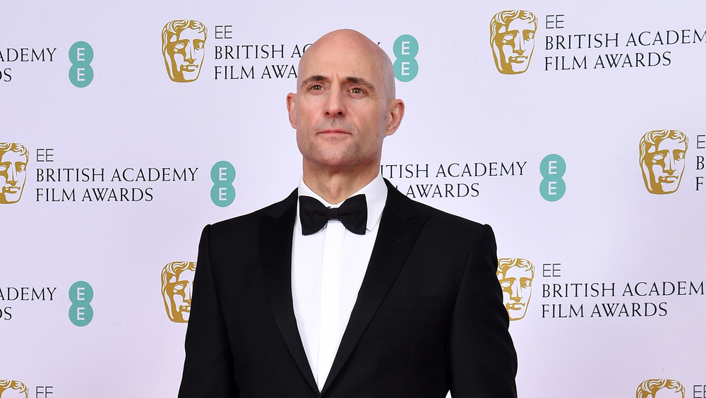Mark Strong posing for photos
