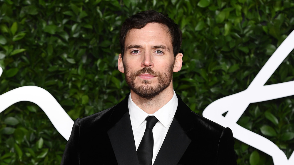 Sam Claflin wearing a suit