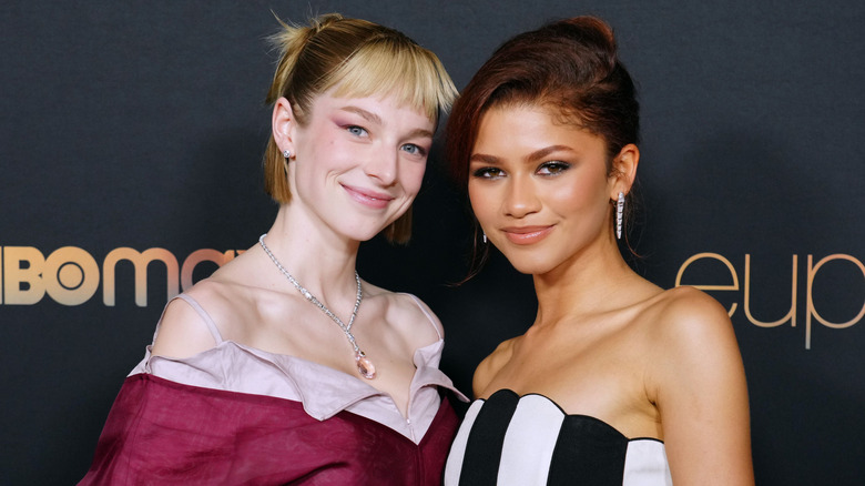 Hunter Schafer and Zendaya posing at an event