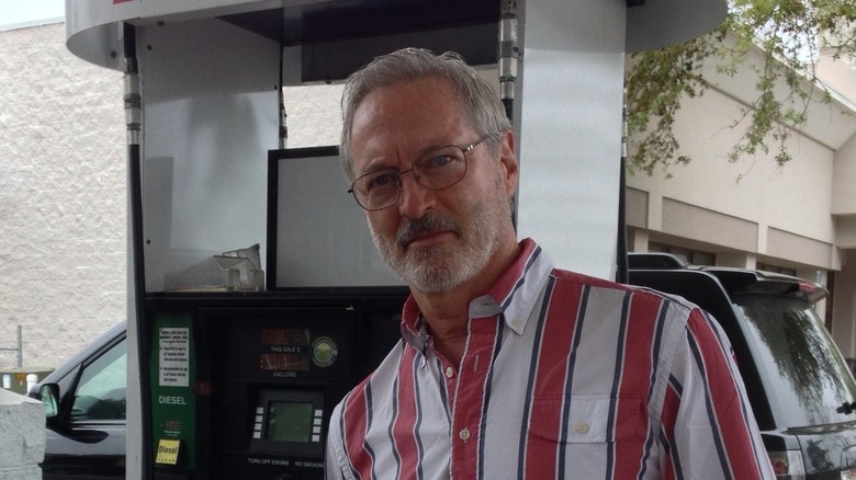 Roscoe Born standing at gas station