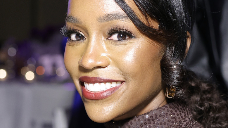 Aja Naomi King smiling