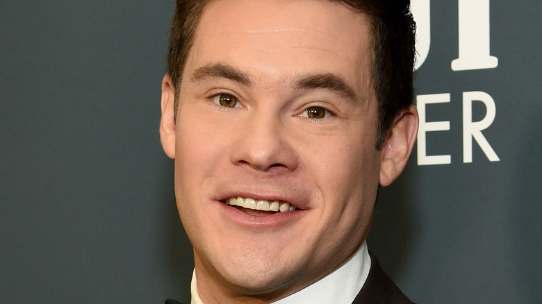 Adam Devine smiling for press