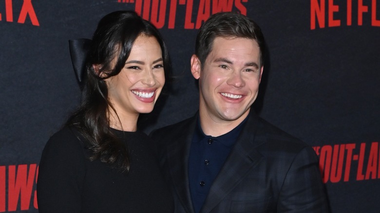 Adam Devine and Chloe Bridges smiling