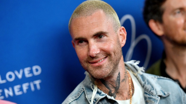 Adam Levine with short blond hair 
