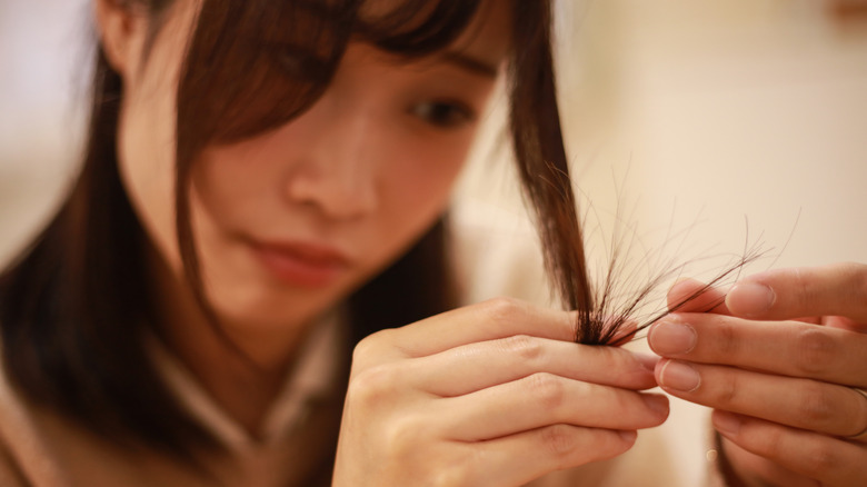 A woman worried about her split ends