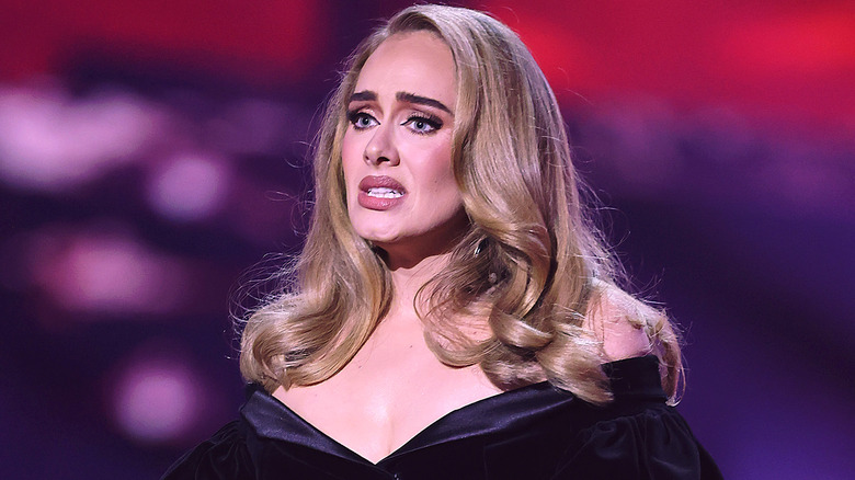 Adele with brows furrowed, look of concern