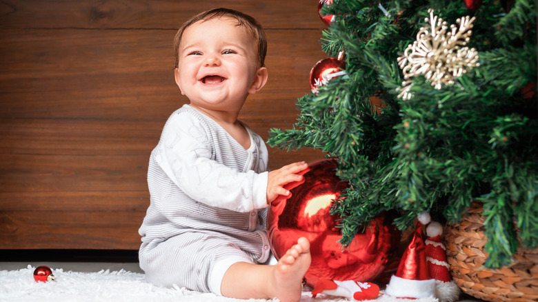 baby with Christmas tree 