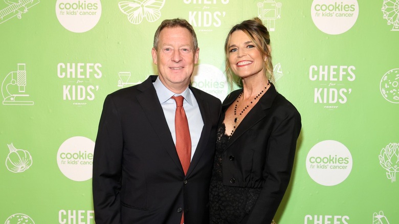 Mike Feldman and Savannah Guthrie smiling side-by-side
