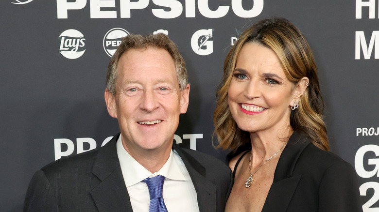 Mike Feldman and Savannah Guthrie smiling