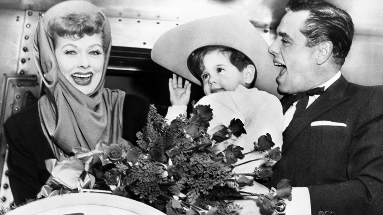 Lucille Ball and Desi Arnaz are shown being greeted by their son, Desi as they arrive home after a 17 day nationwide tour on behalf of the Heart Fund, which they co-chair.