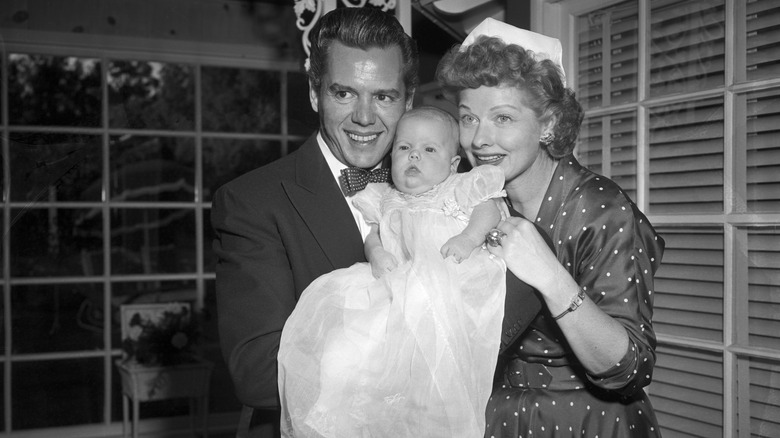 Desi Arnaz and Lucillle Ball pose with their new daughter for the baby's first picture. The couple combined their first names and came up with the name Lucie Desiree Arnaz.