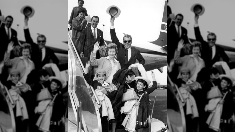 Lucille Ball and Desi Arnaz with their children Lucie and Desi Jr., circa 1959. Behind them is actor William Holden.