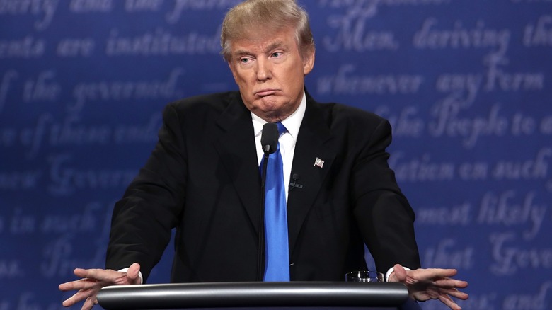 Donald Trump shrugging at the podium