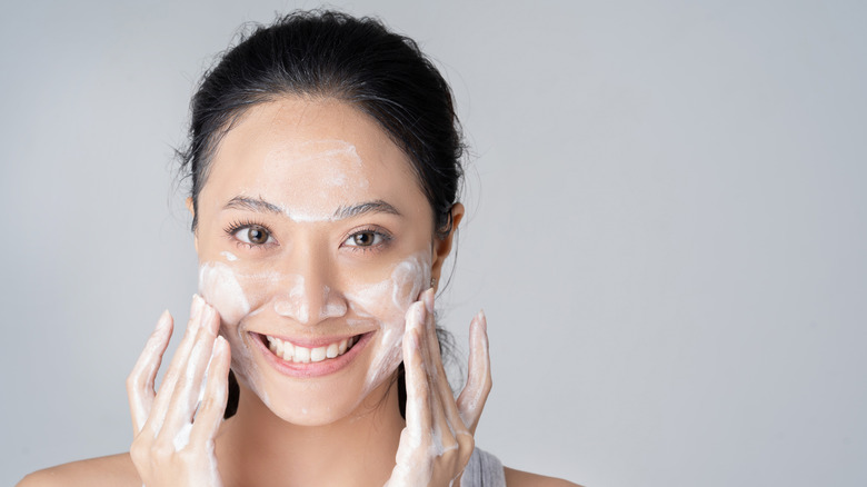 woman washing face