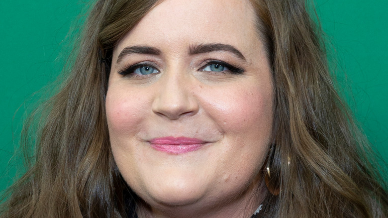 Aidy Bryant poses with a smile