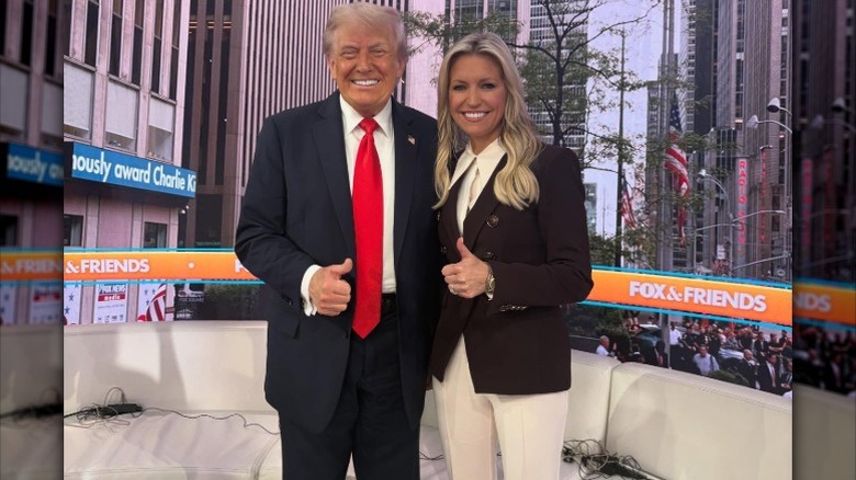 Donald Trump and Ainsley Earhardt give thumbs up together on "Fox and Friends" at Fox News Channel Studios in New York City, NY (2025)