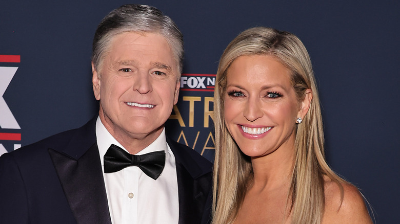 Ainsley Earhardt smiling with Sean Hannity