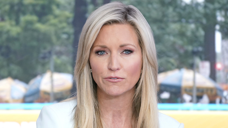 Ainsley Earhardt speaking while wearing a light blue dress at the 'Fox & Friends' studio.