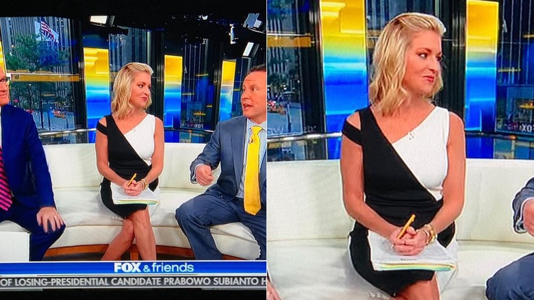 Ainsley Earhardt looking off to her side with her hands in her lap on a white couch.