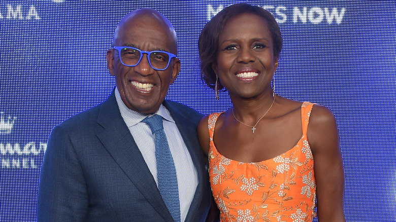 Al Roker and Deborah Roberts smiling while posing together at an event