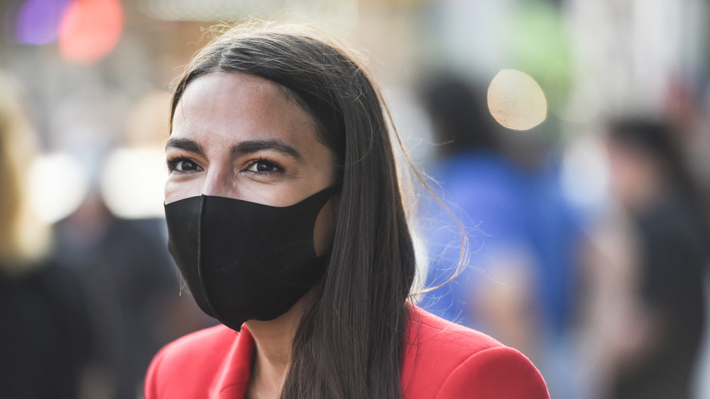 Alexandria Ocasio-Cortez wearing black mask